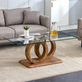 A rectangular modern and fashionable coffee table with tempered glass tabletop and wood grain table legs. Suitable for living room.47.2'*25.4'*17.9'