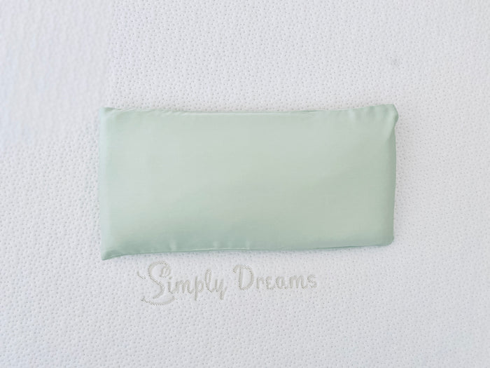 A soft green baby pillowcase made of organic bamboo lyocell