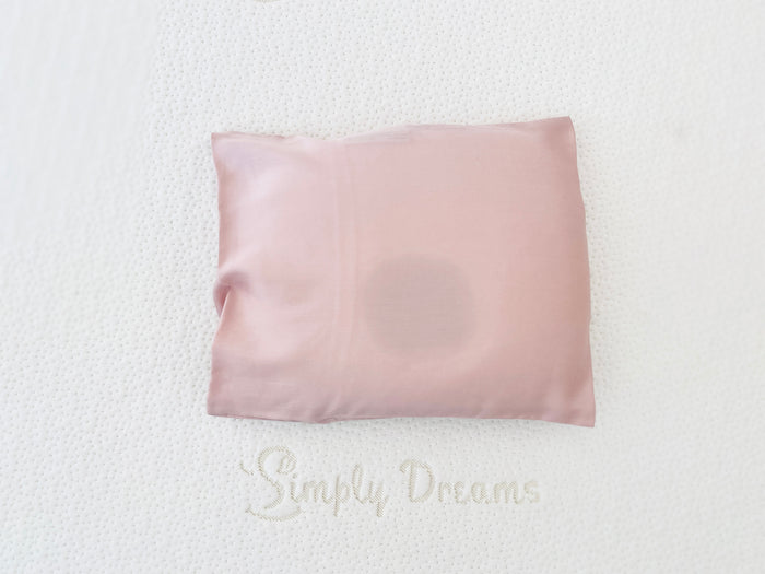pink-colored baby head-shaping pillowcase made of organic bamboo lyocell