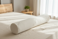A white natural latex bolster pillow