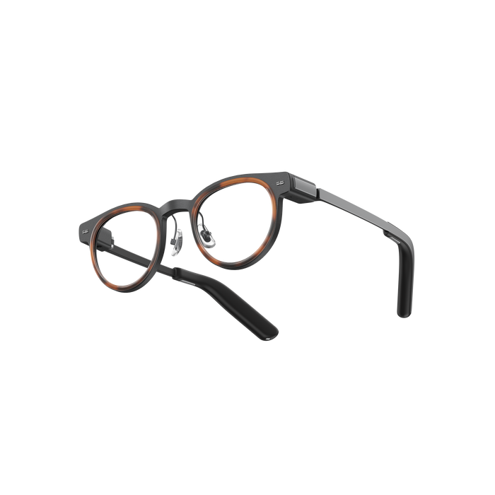 MemoMind One Custom Edition smart glasses with Amber accented frames.