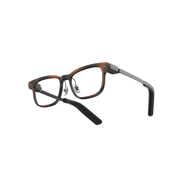 MemoMind One Custom Edition smart glasses with Amber tortoiseshell frames.